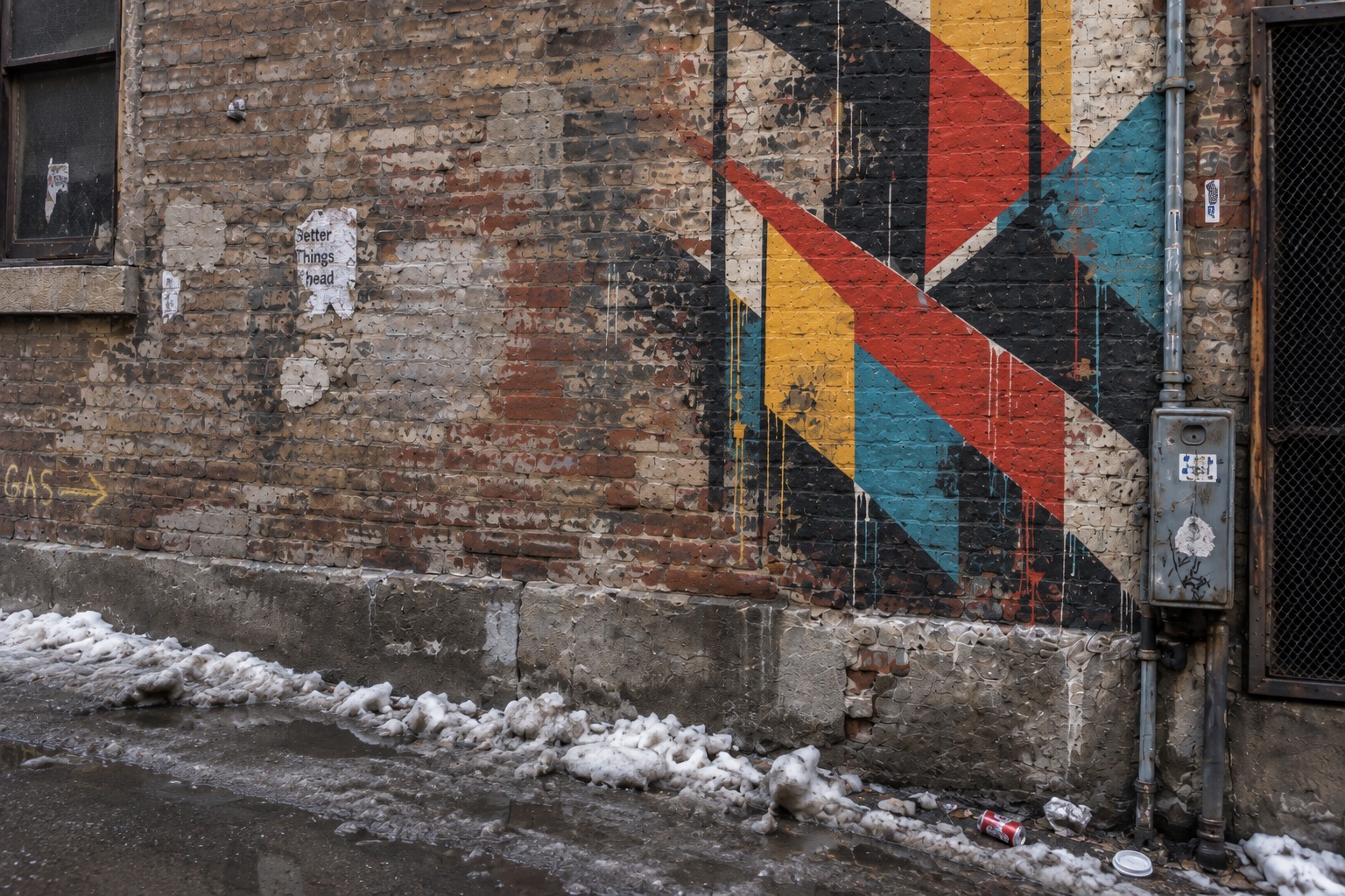 A faded TORON10 monkey mark on the right side of a weathered brick wall.